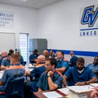 Students seated in classroom with GVSU banners behind them on wall